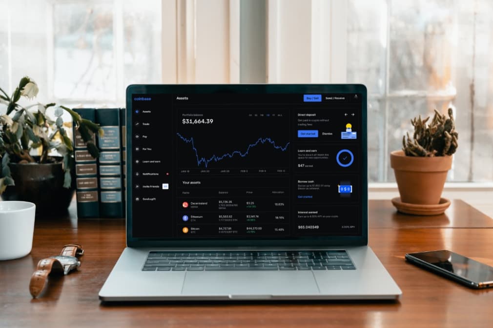 A graph of cryptocurrency price growth on a laptop